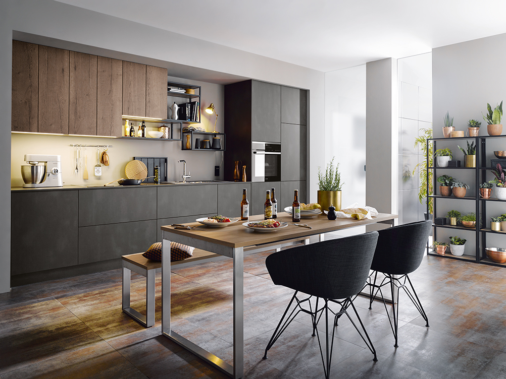 Dark grey one wall kitchen with dining table